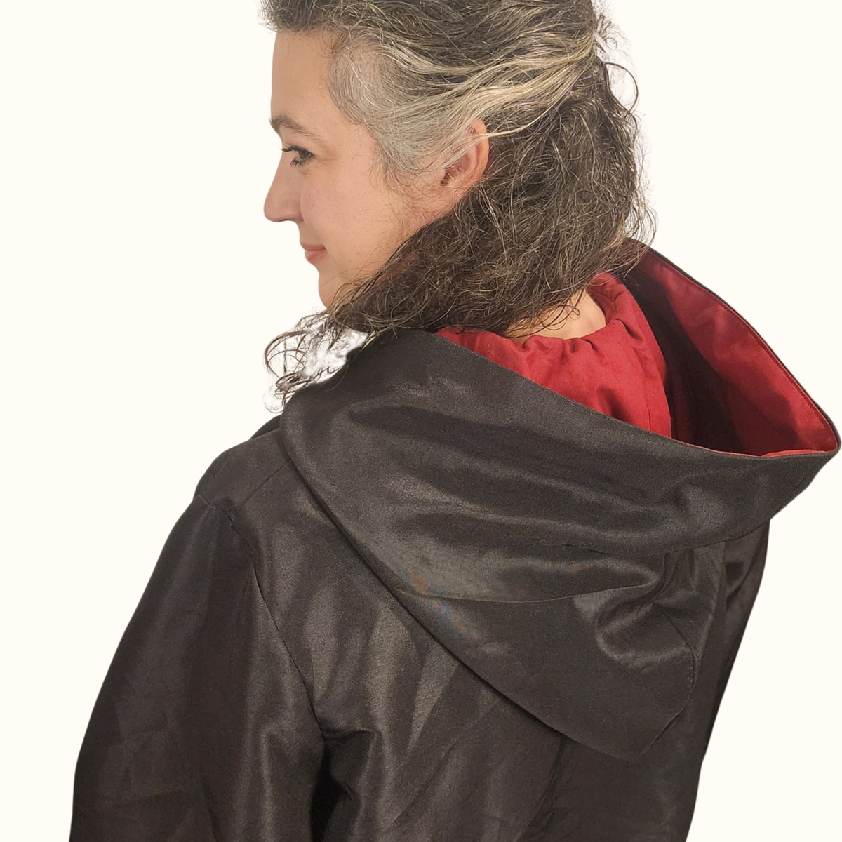 Close-up back view of the wizard robe hood showing the gathered back and red contrast facing around the face opening