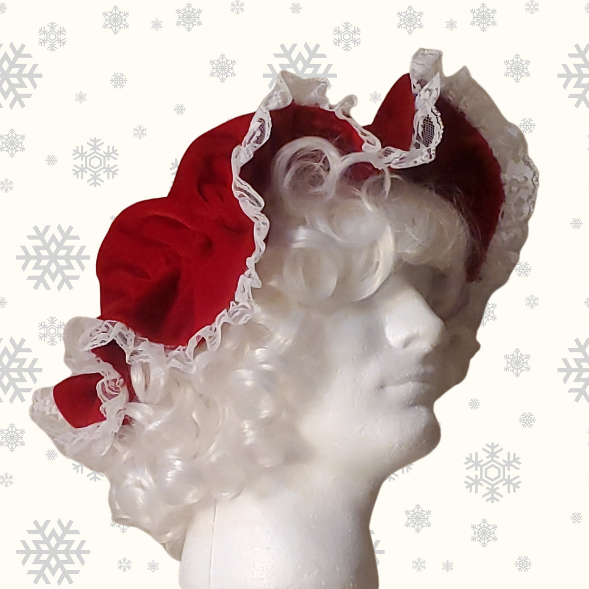 Side view of the red Mrs Claus mop cap with gathered lace trim