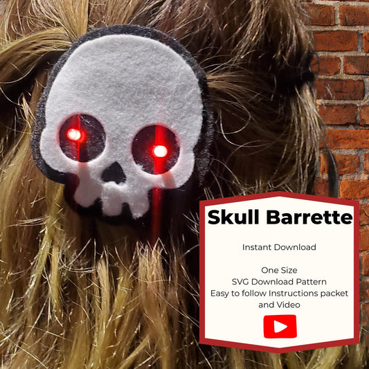 Light-up skull barrette sewing pattern cover showing a white felt skull with glowing red eyes in blonde hair