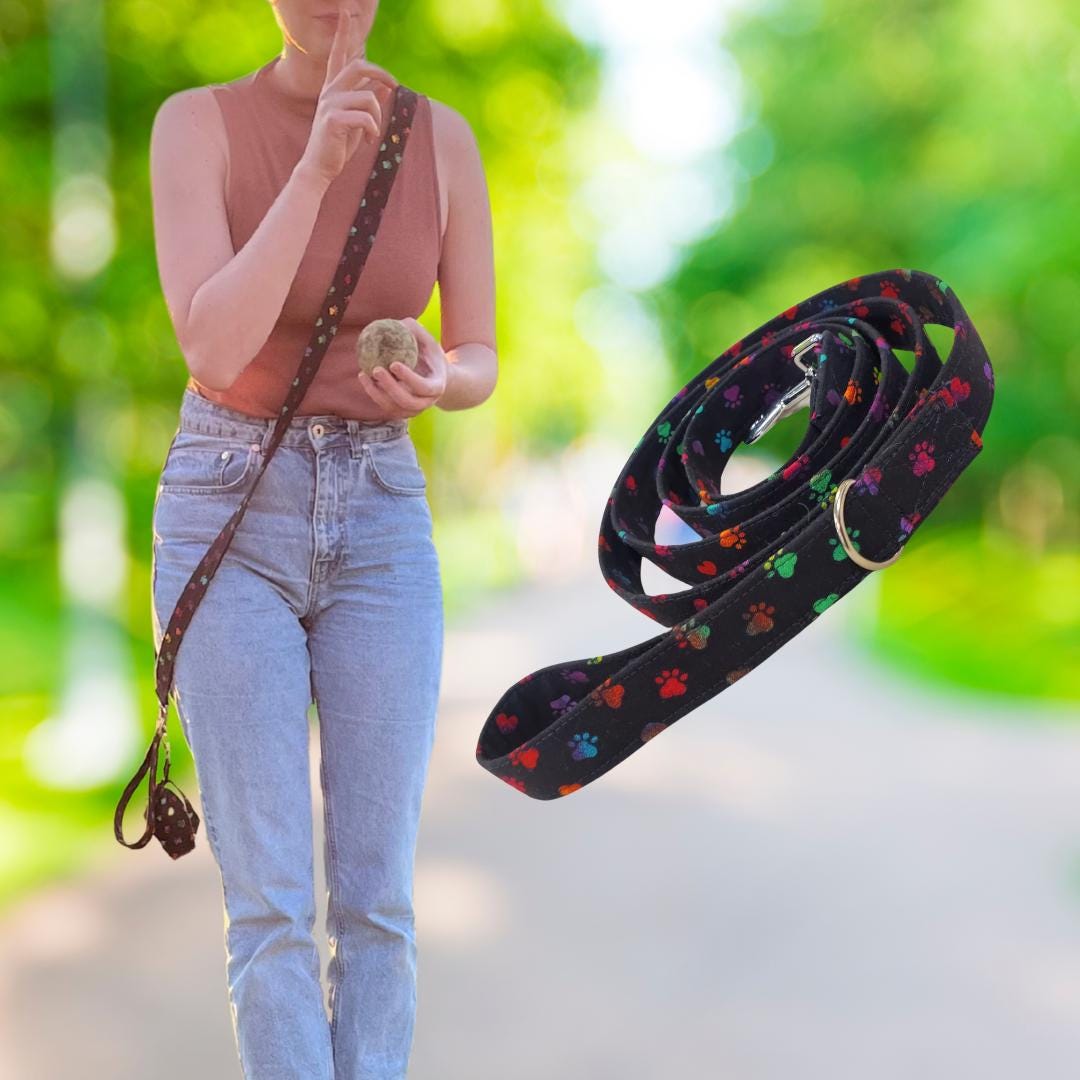 Woman walking with the matching paw print fabric dog leash