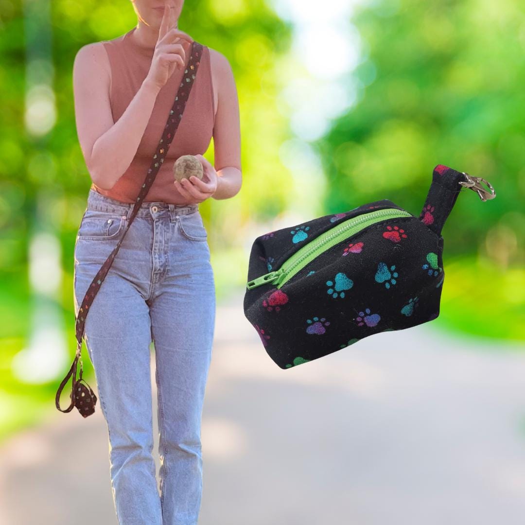 Paw print zippered poop bag holder that clips to the leash