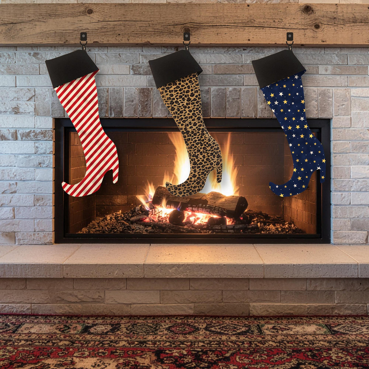 Three high heel boot stockings in red stripe, leopard print and navy star fabrics with black cuffs hanging on a fireplace mantel