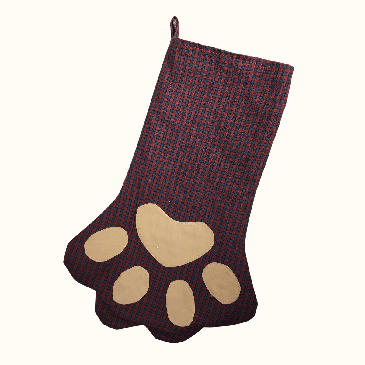 Finished paw print Christmas stocking in burgundy plaid with tan appliqué toe beans and a hanging loop